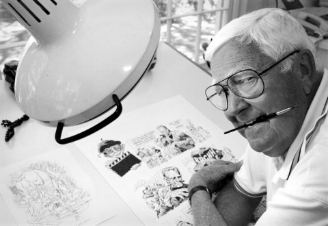 Jack Davis sits at his drawing board at his Georgia home in 1997.